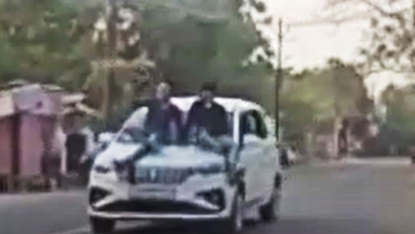 चलती कार के बोनट पर चढ़कर ली सेल्फी, पुलिस ने काटा 7,500 रुपये का चालान